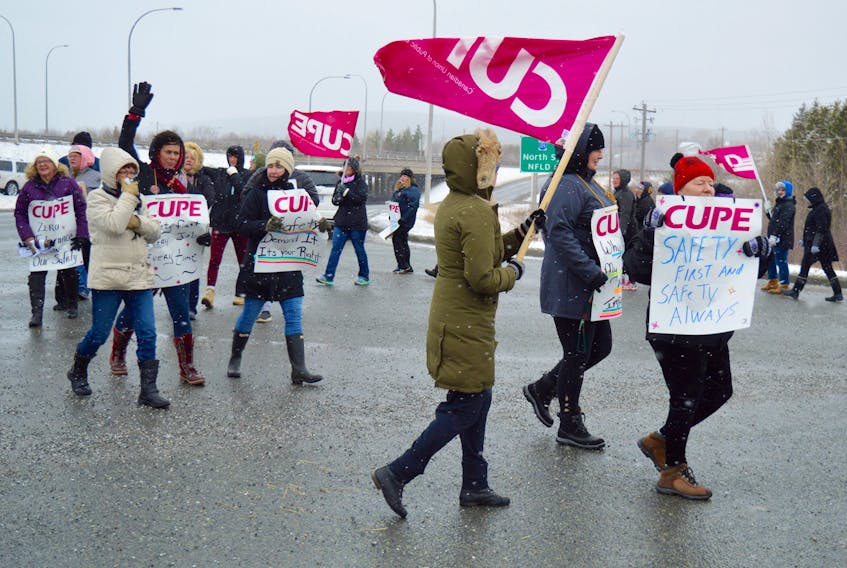More than three dozen unionized employees of the Breton Ability Centre braved Wednesday morning’s wintry weather as they held an information picket line at the main entrance to the Sydney River facility. CHLOE SYMS/CAPE BRETON POST