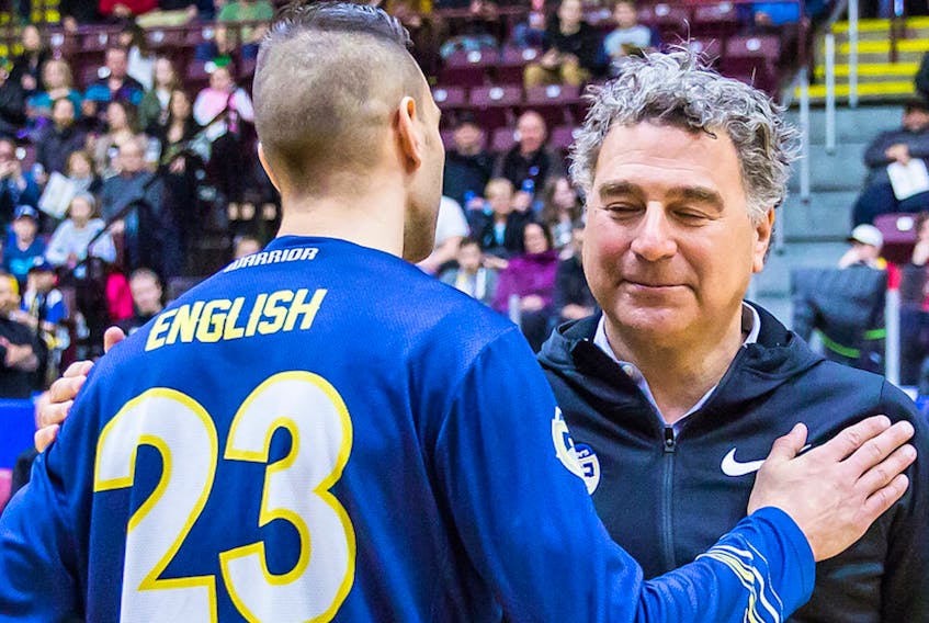 St. John's Edge majority owner Irwin Simon greets Edge star guard Carl English on the court before a National Basketball League of Canada game earlier this year at Mile One Centre. Simon, a native of Glace Bay, N.S., wants to purchase an ownership stake in the Quebec Major Junior Hockey League's Cape Breton Screaming Eagles, but one of the conditions of any sale to Simon is that the team remain in Sydney. — St. John's Edge photo/Jeff Parsons