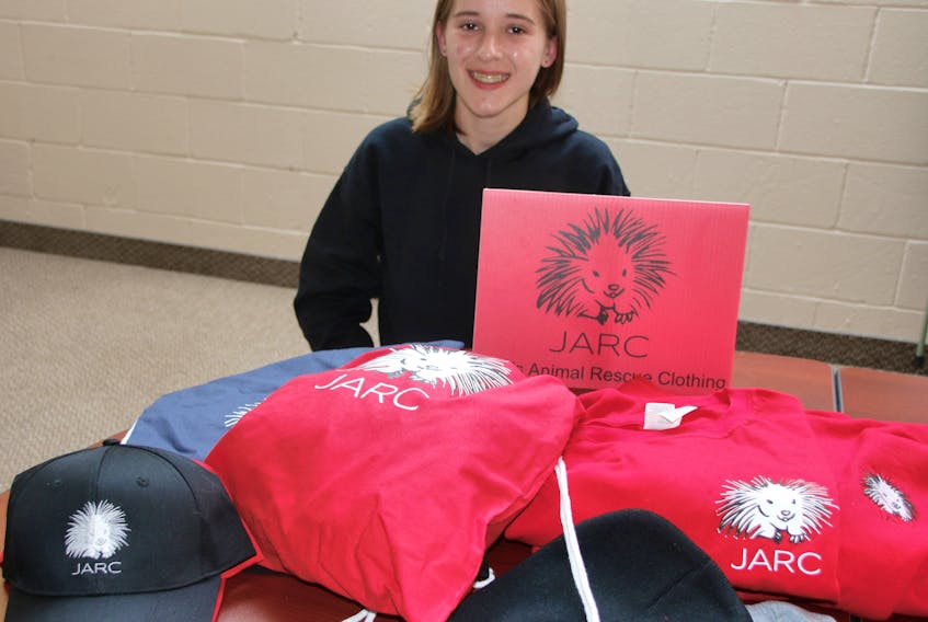 Jaeden MacNeil sells JARC- Jae’s Animal Rescue Clothing-branded items and donates to organizations that help animals. She has shirts, caps and bags bearing the name and a porcupine motif.