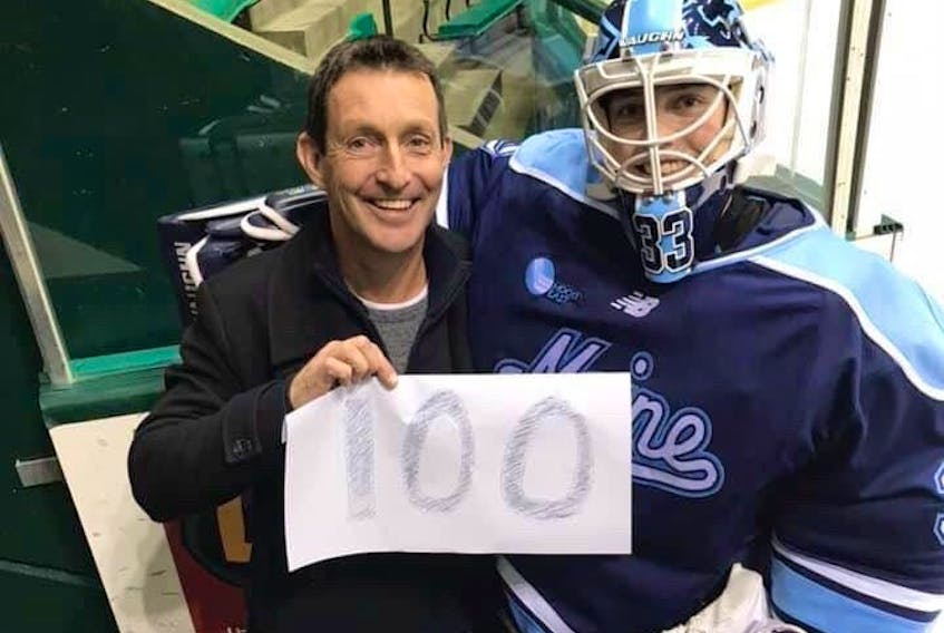 Carly Jackson and her father, Rob, share a moment after the 22-year-old Hastings native played her 100th NCAA game with the University of Maine Black Bears on Nov. 30 at Dartmouth College.
