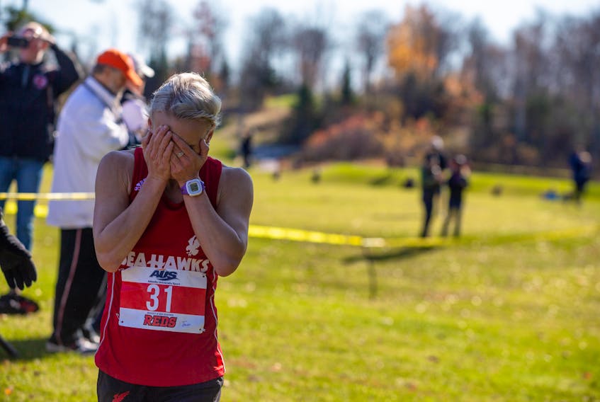 Memorial Sea-Hawks runner Jade Roberts reacts emotionally after winning the Atlantic University Sport female cross-country championship Saturday in Fredericton, N.B. — UNB Athletics/James West