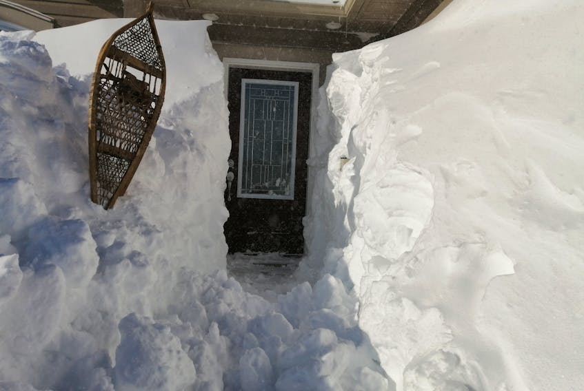 This picture says it all.  
There was no doubt many scenes like this one following last week’s blizzard. 
The photo was taken in St. John’s N.L. by Gary Mitchell. It looks so neat and tidy, but I can only imagine how many hours of shovelling were involved!  Gary says a local description would be “not fit.” I agree.