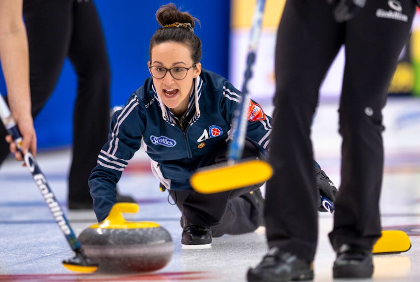 Nova Scotia skip Jill Brothers yells sweeping instructions as she releases her rock during action at the Scotties Tournament of Hearts in Calgary. - Andrew Klaver