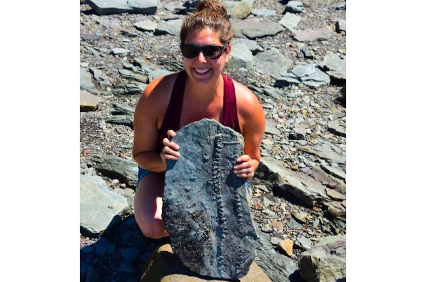 Erin Levy of Halifax displays a specimen of trackways she found on the beach at Joggins. The trackways of a prehistoric salamander-like amphibian and a millipede-like creature arthropleura are being celebrated as a remarkable example of the trackways created 310 million years ago.