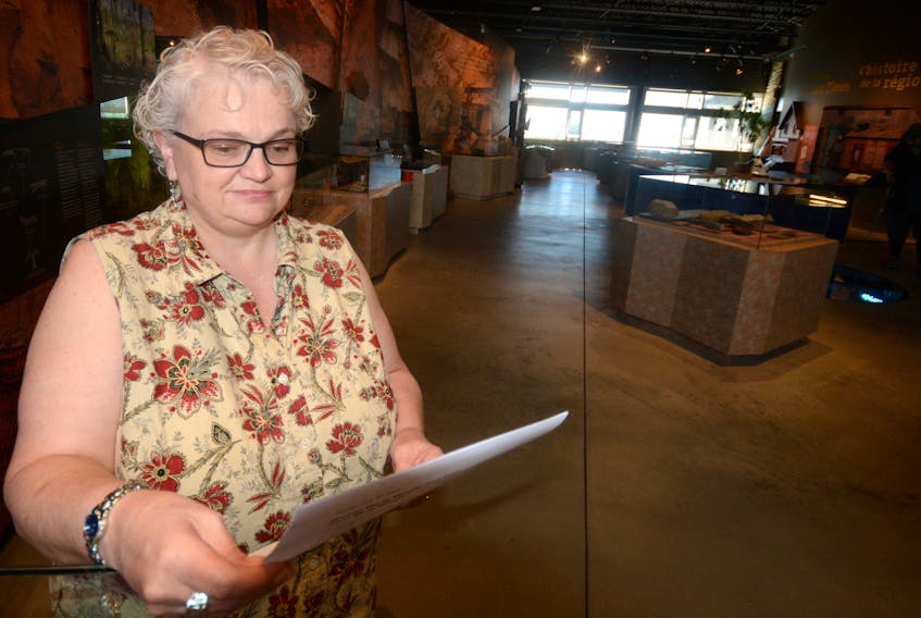Laurie Glenn Norris, education and outreach manager at the Joggins Fossil Institute, goes over the schedule for the 10th anniversary celebrations. A lot of family fun is scheduled for Saturday's event. Glenn Norris grew up in Lower Cove, not far from the Joggins Fossil Cliffs.