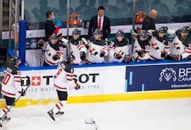 Cornwall's Jordan Spence celebrates his goal Sunday against Slovakia with teammates during Canada's second game at the world junior hockey championship in Edmonton.