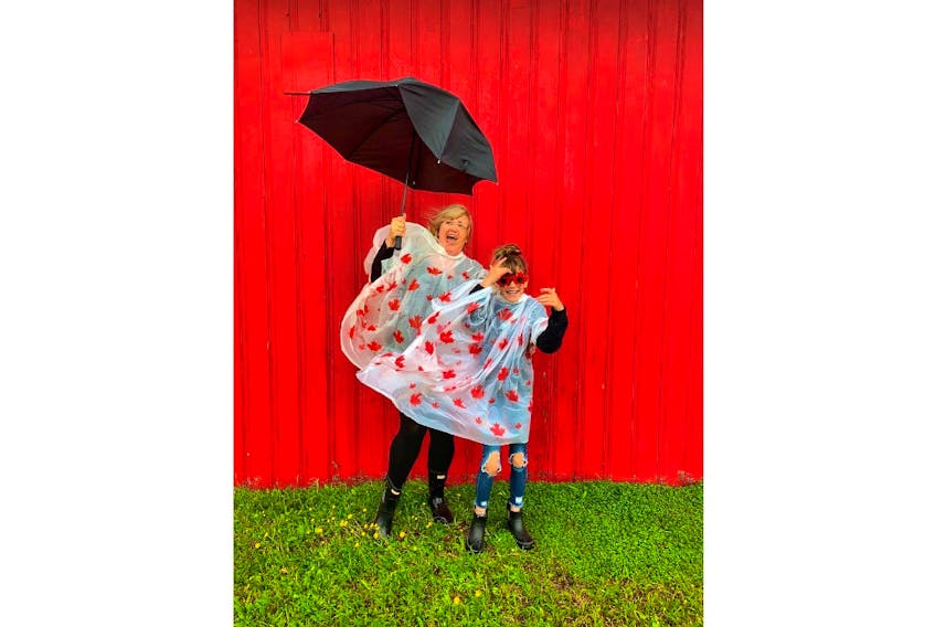 Rebecca Sly and her daughter were dressed for the weather in North Rustico, P.E.I., on Canada Day
