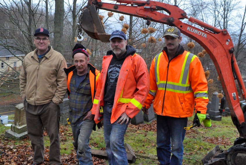 From left: Willowbank manager Chris Fuller stands with Heritage Memorials crew members Andrew Benedict, Chip Peterson and Donnie Nelson, who worked Dec. 1 to restore each gravestone. Not pictured: Jeff Nelson also helped restore the stones.