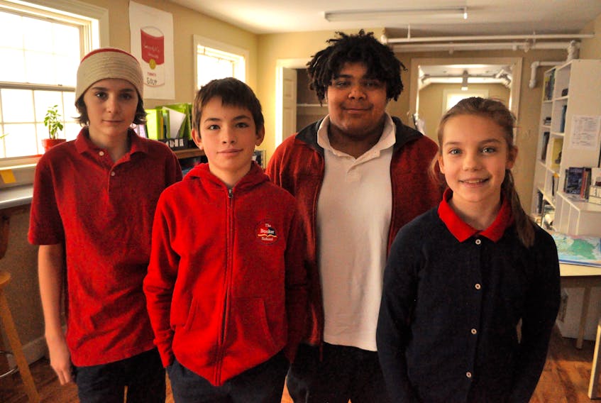 From left: Henry Mulherin, Forrest Robinson, Will Mercer and Hana Hutchinson, four of the Booker School students who came up with a unique solution to the imposing Cornwallis Statue, which stood atop a pedestal until temporarily removed Jan. 31 in Halifax.