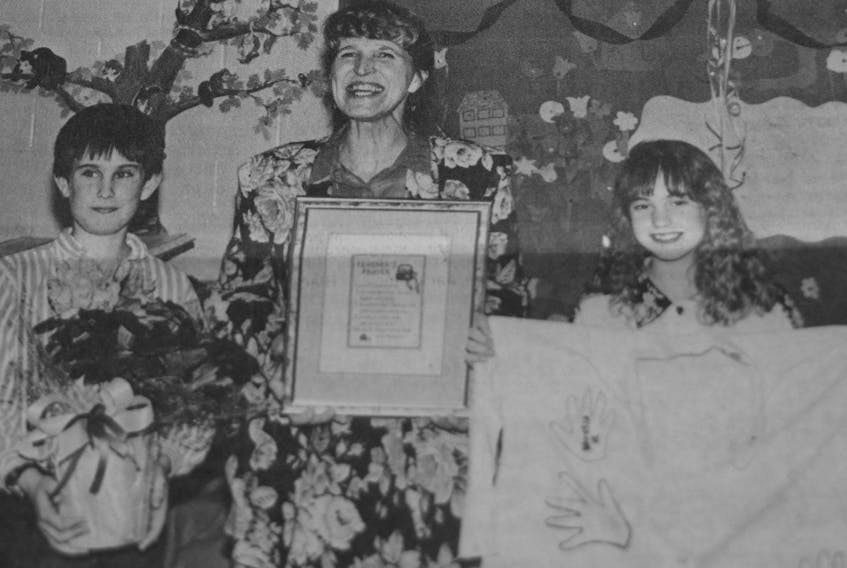 In 1994, Joel Neily and his younger sister Lacey were excited to present retiring Falmouth teacher Edith Johnson with a bouquet of flowers and a t-shirt featuring handprints and signatures on it to thank her for her years of teaching at the elementary school.