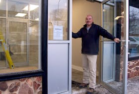 Paul Dixon stands at the entrance to SafeGuard’s new office space inside the Cornwallis Inn. The entrance was formerly used for the building’s liquor store.