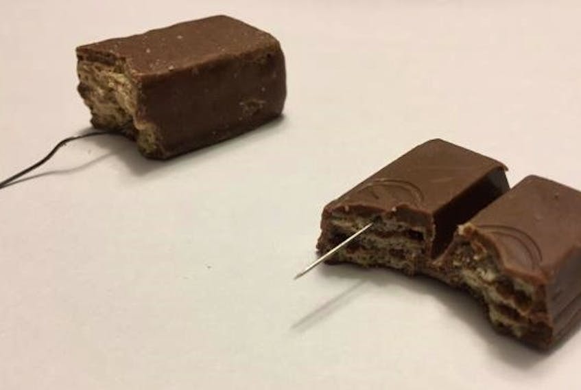 The two pieces of chocolate reported in Timberlea, one with a paper clip inside and the other with a needle. These, along with the flat piece of metal found in Port Williams, did not appear tampered with to the children who opened them.