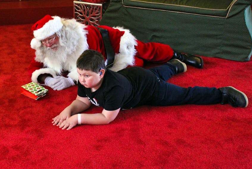 Austin Thorpe, eight, is one of many children with autism who take part in Quiet Santa, an event organized by the Annapolis Valley Chapter of Autism Nova Scotia. His mother, Jackie Thorpe, says seeing her son visit with Santa was amazing. “It was a ‘follow Austin’ kind of deal, and Santa was amazing,” she says.