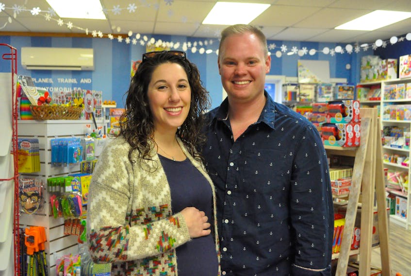 The Inquisitive Toy Company owners and partners Miranda and Jake Rideout, who are expecting a baby, say their busiest time of year is the Christmas season. “It’s so much fun owning a toy store at Christmas,” said Jake.