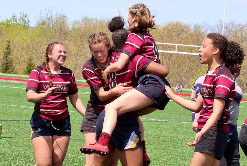 Citadel senior girls react to winning the semi-final bout June 1 to advance to the provincial rugby finals.