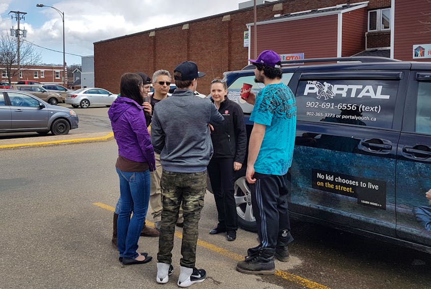 Portal director Russ Sanche stands outside the outreach centre with a group of youths who regularly visit the centre and make use of its services. “Seldom do we meet a youth who’s on their first experience with homelessness,” he says.