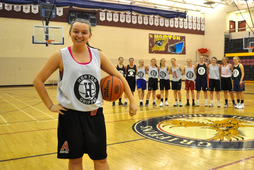 Meghan MacLeod stands with her Horton High School basketball Division 1 teammates, a group of girls she says have become her best friends. She’s taking the year to focus on her shooting and offensive play as she ramps up for university tryouts.