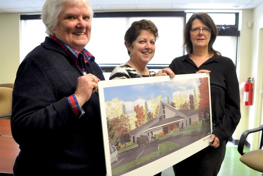 Diana Patterson, Fern Brydon and Dale Sanford stand with a rendering of final design plans for the new hospice to be built as a standalone building onsite at the Valley Regional Hospital in Kentville. Ground will be broken this spring.