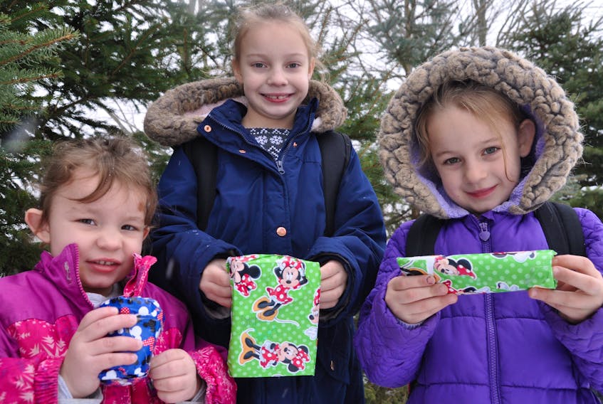 Sisters Arionna Pinch, four, Haley, eight and Kayla, six all check their Waterville mailbox each day from Dec. 1 to 21 to see if their magical Christmas elf has left little gifts or notes for them. “It’s not about the gifts or bows. It’s about making them happy to be together,” said their mother Linda Pinch.