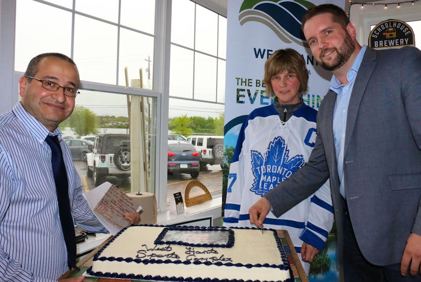 From left, West Hants Warden Abraham Zebian, Coun. Debbie Francis, and Andy Knowles, of Lindsay Construction, prepare to cut the cake at the official fundraising launch party for the West Hants sportsplex.