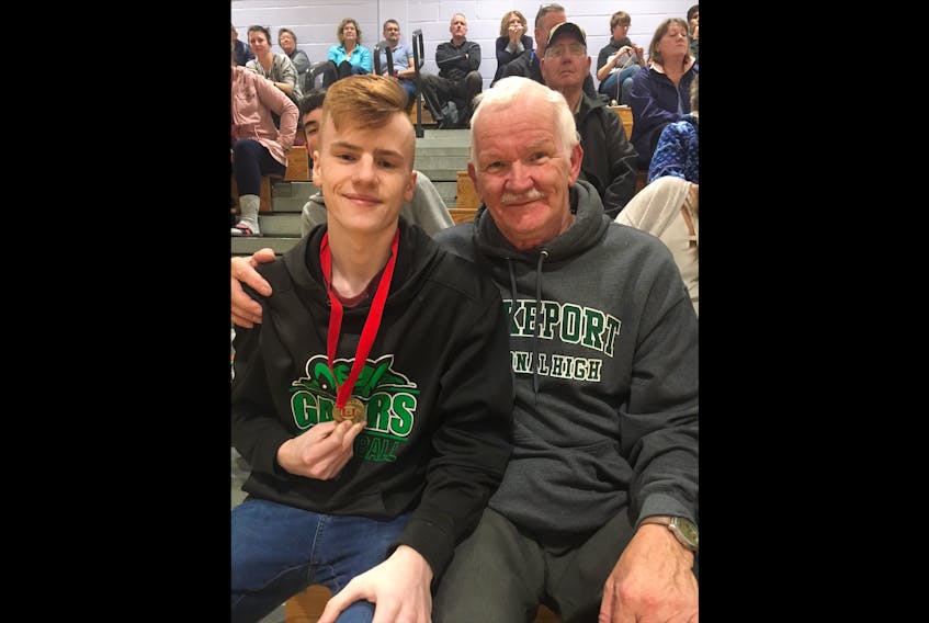 Nathan Parnell holds the medal given to him by Shelburne resident Walter Nickerson, who admired his leadership on the court. The medal has become Parnell's good luck charm, and he said "it's something I’ll hold on to and cherish forever."