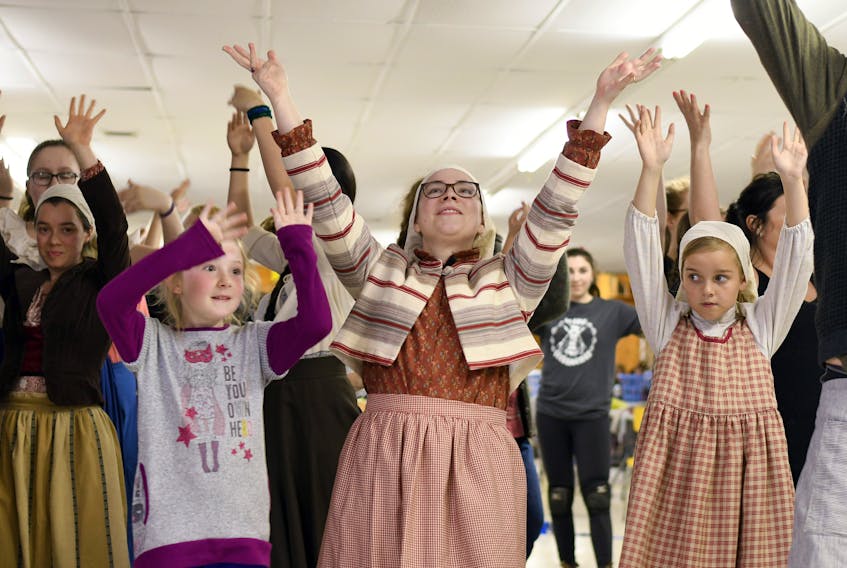 Members of the cast of Fiddler on the Roof performing the classic opening number "Tradition." (photo credit: Peter Oleskevich)