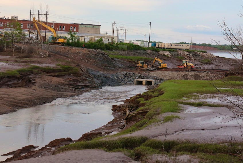 With the twin culverts installed at the mouth of the Halfway River, construction crews were hard at work filling in the area on June 14. It’s anticipated the job will be finished by early July.