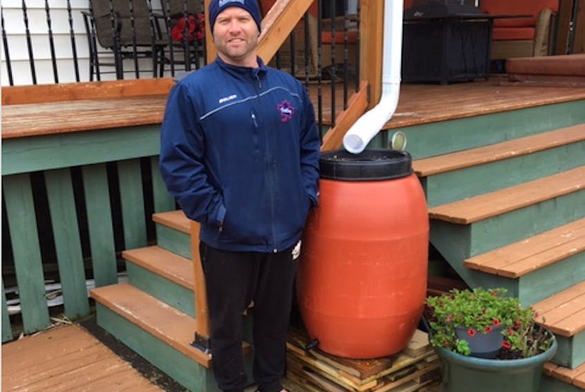 The Valley Maple Leafs are hoping the club’s latest fundraiser will not only raise funds for the Junior B squad but will help people conserve water this summer. Pictured is the Leafs’ general manager Josh Dill with one of the rain barrels that are available to purchase.