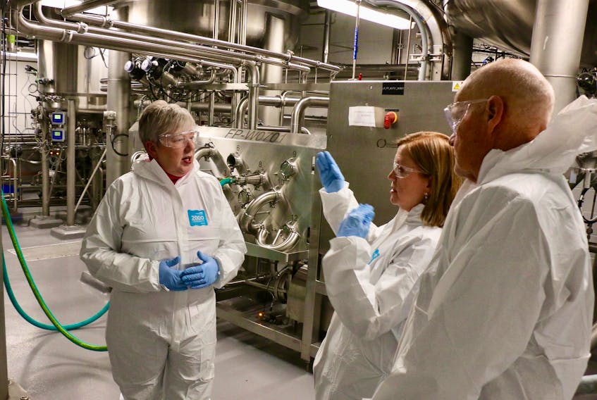 Heather Delage, the general manager for BioVectra’s West Hants location, answers questions from  Bernadette Jordan, the federal minister of rural economic development, and Kings County Mayor Peter Muttart about the company’s fermentation process.