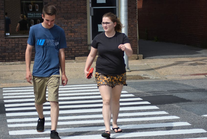 Pedestrians cross Webster Street in downtown Kentville June 12.