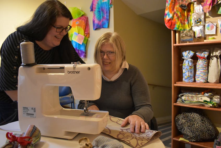 Support worker Tara Steadman and CAPRE client Jenny Boersma teamed up to build a business venture around the idea of producing wine bags to sell locally.