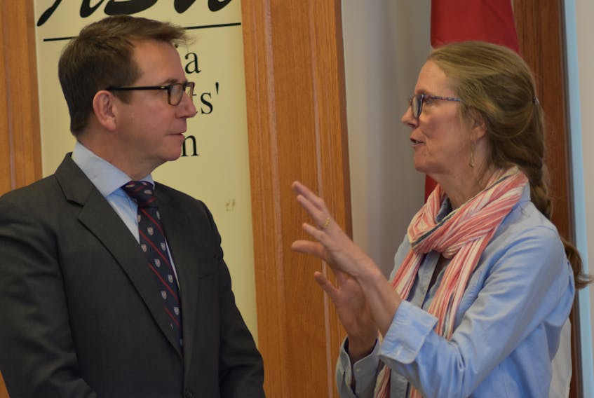 Kings-Hants MP and President of the Treasury Board Scott Brison mingles with Pie-R-Squared business owner Heather Lunan following a federal funding announcement for the Acadia Entrepreneurship Centre Jan. 16.