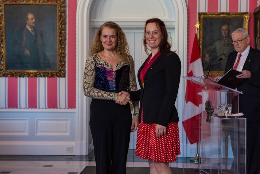 Booker School teacher Temma Frecker shakes hands with Governor General Julie Payette after being presented with the Governor General’s History Award for Excellence in Teaching. -- Andrew Workman/Canada’s History Society