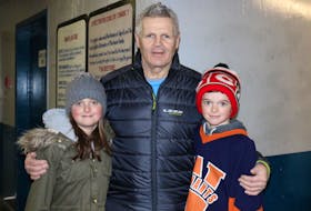Chris Nilan, a.k.a. Knuckles, a retired enforcer with the Montreal Canadiens, meets young fans 10-year-old Lindsay MacDonald and 11-year-old Jeremy MacDonald, of Garlands Crossing, following a game of shinny Jan. 26. Nilan was one of the celebrity hockey players to take part in the 2019 Legends of Hockey Long Pond Classic.