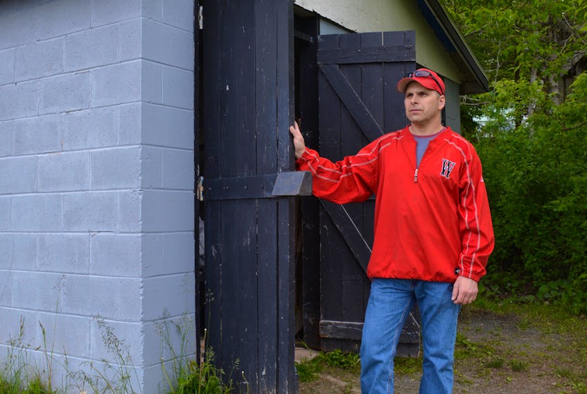 Stephen Sauveur, president of WHMBA, by the shed where maintenance equipment was stolen.