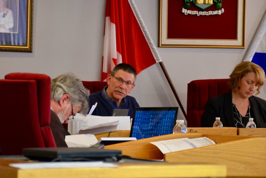 Doug Armstrong, the Town of Windsor’s director of finance, centre, goes over line items in the proposed budget on March 13.