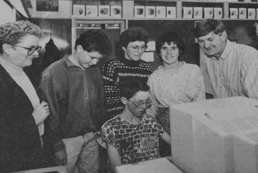 Students in Grades 7 and 8 attending Windsor Regional High School requiring additional assistance with their studies in 1994 could now visit the Resource Room to get help. Pictured are, from left, teacher assistant Mary Lou Lake, Jacob Pollard, teacher assistant Suzanne McIntyre, John Milne (seated), Holly Fraser, and resource teacher Jerry Sawler.