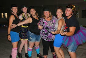 From left, Wendy Jordan (Bitta Badness), Katherine Brown, Evelyn Keddy (EvilLyn), Heather Deveaux, Kim Sutherland (Diva Slayer) and Marjie Lynn (Tainted Shove) pose for a photo while singing along to Summer Nights during a disco derby fundraiser at the GFL Newport Recreation Centre July 28.