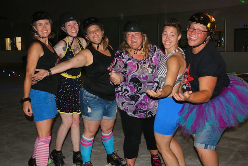 From left, Wendy Jordan (Bitta Badness), Katherine Brown, Evelyn Keddy (EvilLyn), Heather Deveaux, Kim Sutherland (Diva Slayer) and Marjie Lynn (Tainted Shove) pose for a photo while singing along to Summer Nights during a disco derby fundraiser at the GFL Newport Recreation Centre July 28.
