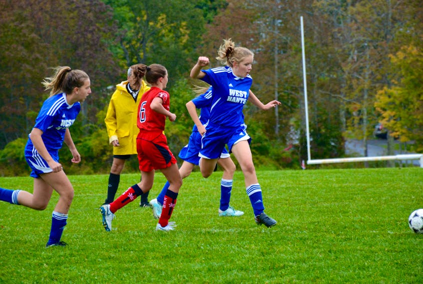 West Hants Middle School and King’s-Edgehill School junior girls battle for control of the ball on Oct. 2.
