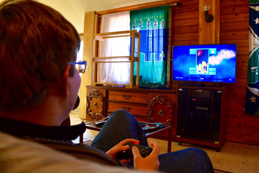 Brian Dolmatov, 18, plays Tetris Ultimate on his PS4 at his home in Falmouth. Dolmatov has been playing video games for most of his life but doesn’t feel that he’s addicted to the medium.