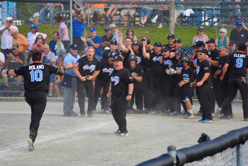 Ryan Boland, Number 10 with the Newfoundland Galway Hitmen runs to home plate and a jubilant team, after hitting a grand slam.