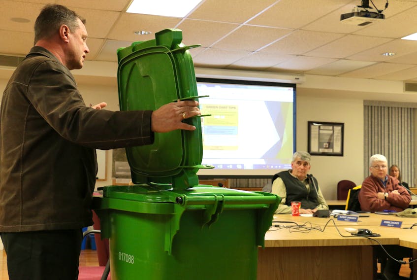 Paul Speed, of Speed Eco Products, shows off a heavy-duty lid that can be used on West Hants' new green carts that will help make them bear resistant. Speed attended West Hants' committee of the whole meeting Feb. 27, 2018 to explain the upcoming roll out of the organics recycling program in the county.