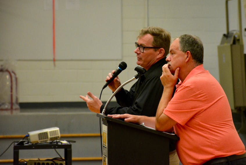 Rodyen Trainor (left), executive director with the department of transportation and infrastructure answers questions while West Hants councillor Paul Morton listens.