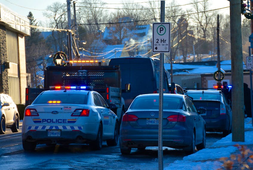 Emergency responders attend to the scene after a woman was struck by a vehicle on Water Street on Dec. 11.