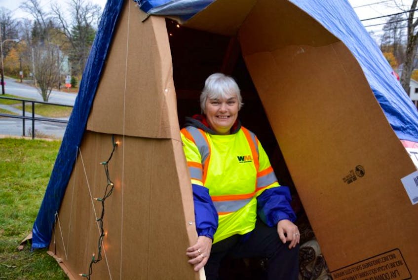 Donna Eldridge, coordinator of Harvest House, spends a night in the tent on King Street to help raise awareness of homelessness in the community.