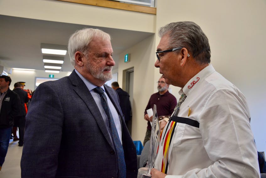 Kings-South MLA Keith Irving (left) and Glooscap First Nation Chief Sidney Peters chat during an event at the new Glooscap Community Centre. Irving recently announced the approval of solar projects at 11 First Nation communities, including Glooscap.