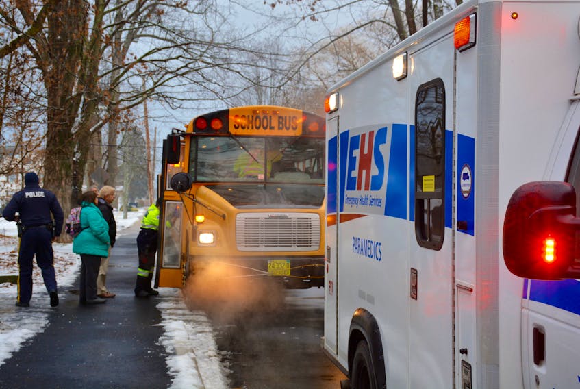 Paramedics checked school bus passengers for injuries Dec. 19 in Windsor.