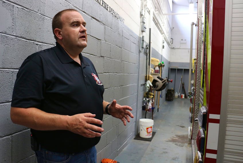 Hantsport deputy fire chief Paul Maynard discusses the tight quarters in the fire bay. The firefighters recently relocated their bunker gear, which was previously located in the main bay behind the fire trucks, to make it safer for firefighters responding to calls.