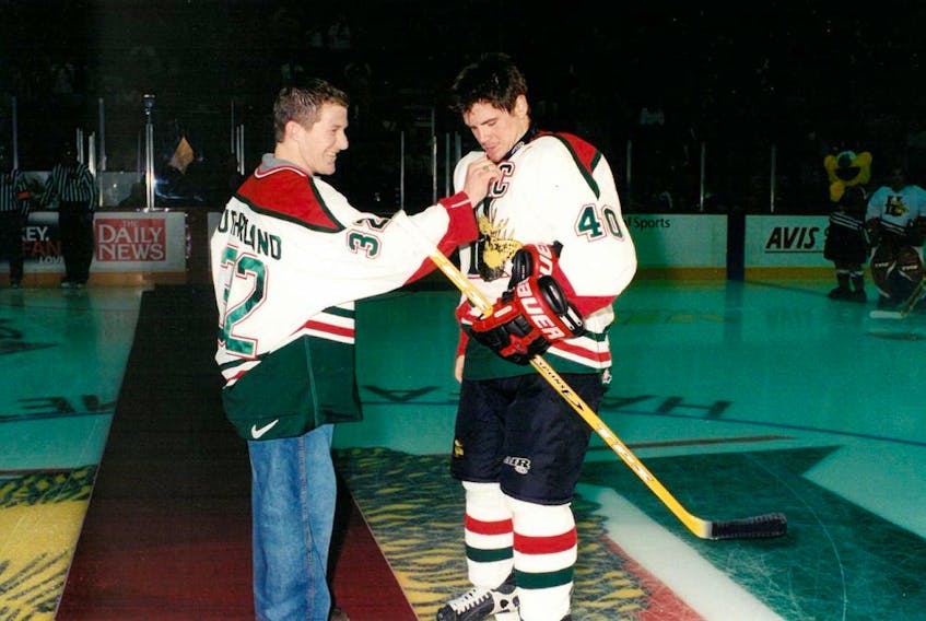 From 2002, when Robbie Sutherland came back to hand over the "C" to friend and former teammate Brandon Benedict with the Halifax Mooseheads. Photo courtesy Halifax Mooseheads